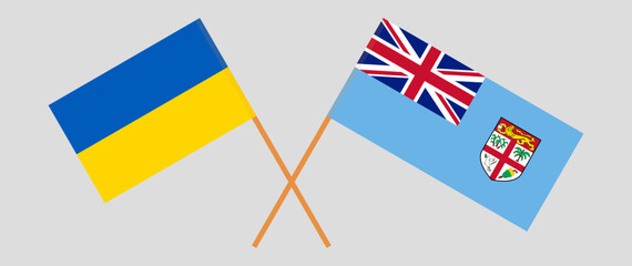 Crossed flags of Ukraine and Fiji. Official colors. Correct proportion