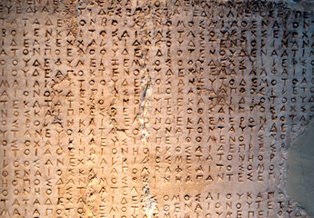 ancient greek letters in stone