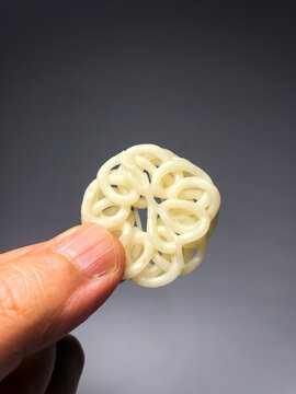 Close-Up Of Hand Holding Indonesian Crackers (Kerupuk)