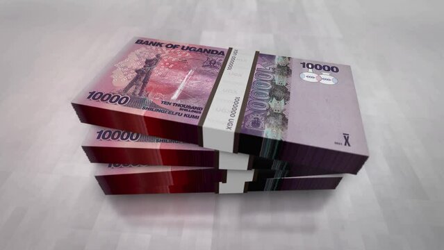 Uganda money Shilling money pile pack. Concept background of economy, banking, business, crisis, recession, debt and finance. 10000 UGX banknotes stacks 3d animation.