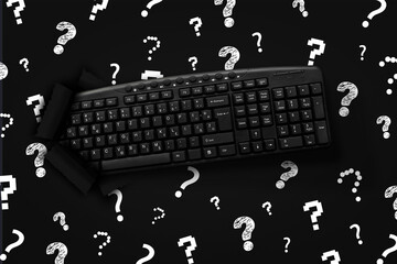 PC keyboard with Question marks on black background
