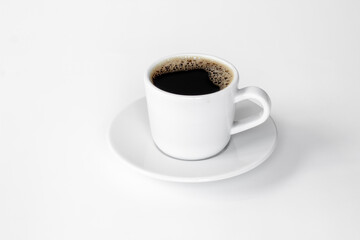 White cup of hot espresso coffee. Morning routine concept
