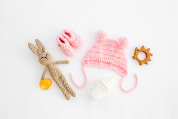 Baby girl pink hat with booties and accessories, top view