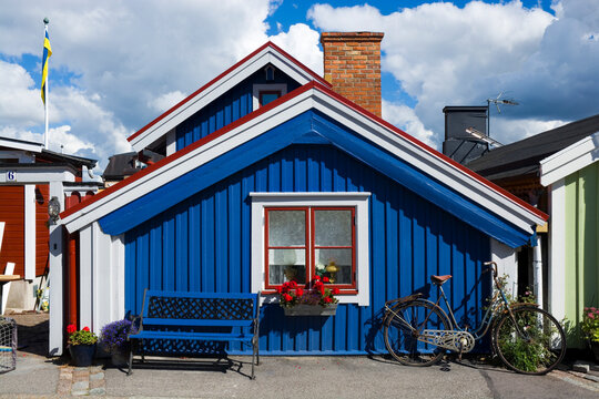 Colorful wooden houses in Bjorkholmen, the oldest district of Karlskrona, Sweden