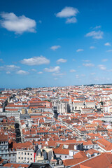Fototapeta na wymiar Views of buildings of orange brick in Lisbon