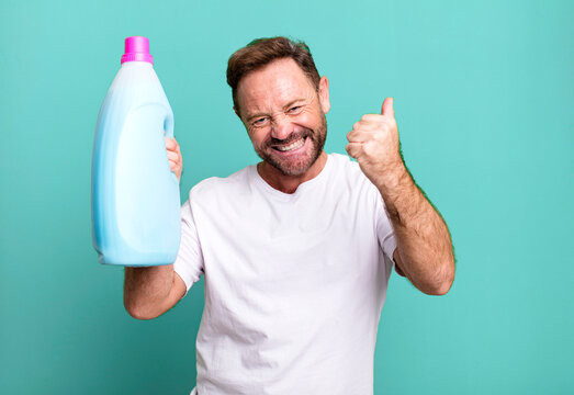 Middle Age Man Housekeeper Concept With A Dirty Clothes Basket Sport Coach Concept With A Soccer Ball