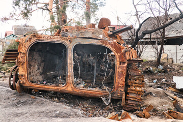 A burnt armored personnel carrier of russians in a village near Kyiv