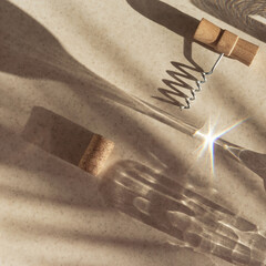 Creative composition made of corkscrew and cork of wine on pastel background with sunlit and...