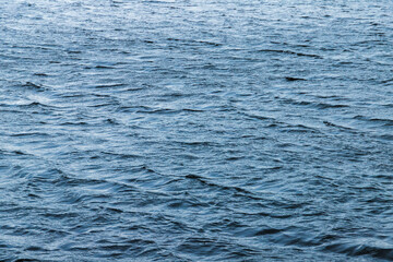 Blue sea water surface with ripple pattern, abstract natural background
