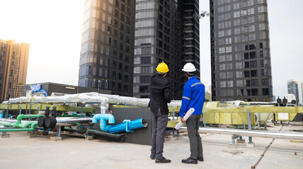 Professional inspection engineering use drone for survey building under construction site.