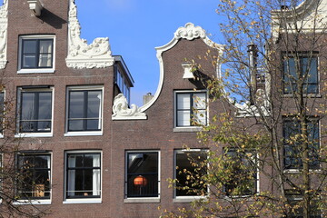 Amsterdam Keizersgracht Canal House Facade with Bell Gable and Blue Sky Close Up, Netherlands