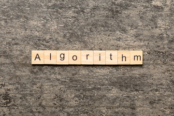Algorithm word written on wood block. Algorithm text on table, concept