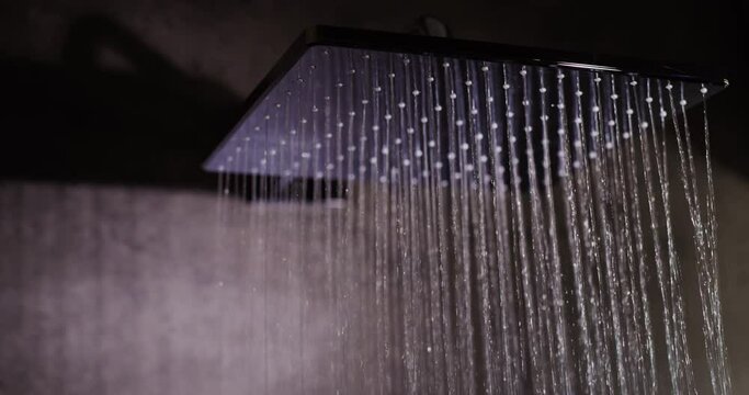 Jets of water pour from a modern diffuser shower system