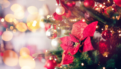 Banner dark red decorated christmas tree pine on blurred background bokeh sun light