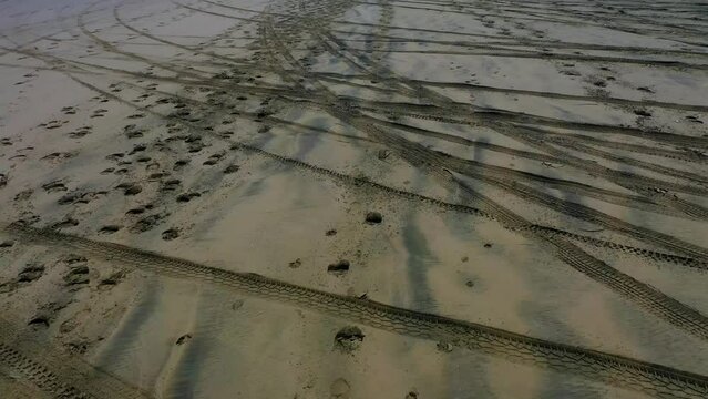Traces on the sand of Muriwai Beach. North Island, New Zealand.