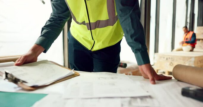 Hands of architect check blueprint at construction site for building, house or real estate industrial development. Architecture industry man, engineer and contractor inspection of project design plan
