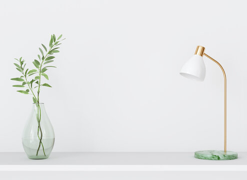 Interior wall mockup with green plant in vase  and lamp on empty white background with free space on center. 3D rendering, illustration.