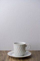 white coffee mug on wooden table