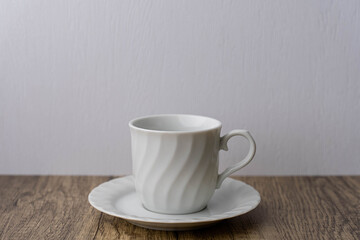 white coffee mug on wooden table