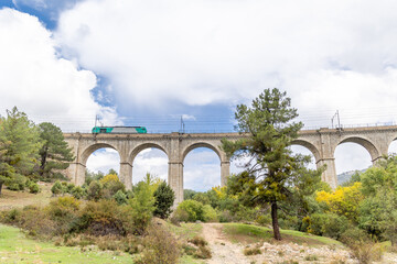 Fototapeta premium railway bridge that crosses the cofio river in the Sierra de Guadarrama, Madrid