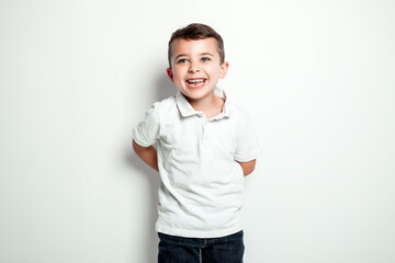 five year old boy posing over white studio background © Louis-Paul Photo