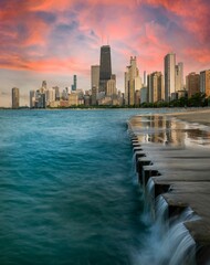 Vertical shot of Chicago Downtown with high skyscrapers at sunset in cloudy sky background