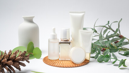 moisturizing cream bottle over leaf background studio, packing and skincare beauty concept.