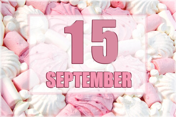 calendar date on the background of white and pink marshmallows. September 15 is the fifteenth day of the month