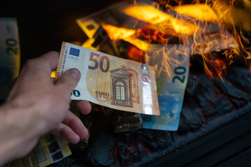 Fototapeta premium euro banknotes fire in fireplace