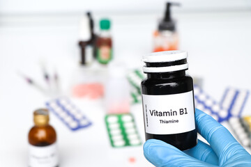 Vitamin B1 pills in a bottle, food supplement or used to treat disease