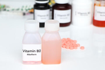 Vitamin B2 pills in a bottle, food supplement or used to treat disease