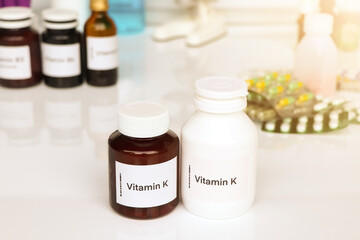 Vitamin K pills in a bottle, food supplement or used to treat disease