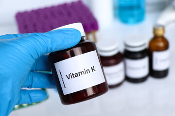 Vitamin K pills in a bottle, food supplement or used to treat disease