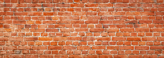 Brick wall background, wide panorama of brick masonry, horizontal old brick wall panorama, red...