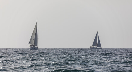 Sailboat on the horizon of the Mediterranean Sea