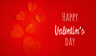 Red hearts on a red background