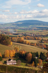 Fototapeta premium beautiful autumn landscape. view from the mountain to the green fields, trees. tranquility and nature