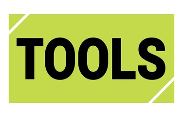 TOOLS text written on green-black stamp sign.