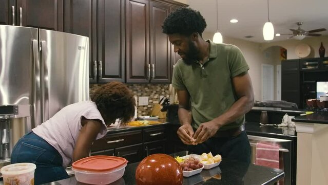 Young Black children, Black girls, Black boy, Black infant baby, Black parents, Black mother, and Black father cooking and eating lunch and dinner at home