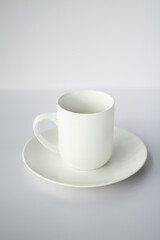 white cup on a saucer