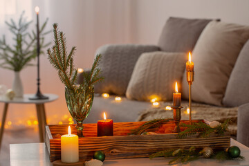 cozy home with christmas decor on wooden tray