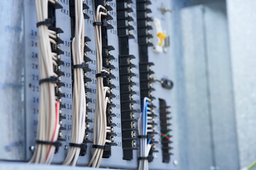 Electric control panel. The wires are connected to residual current circuit breakers and voltage monitoring relays. High quality photo