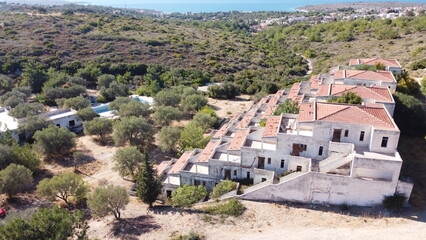 Obraz premium Lost places: Aerial view of an unfinished hotel complex in Izmir, Turkey with 96 apartment rooms is left to decay. Roof tiles, walls broken. Terrace construction already overgrown by nature lies in ru