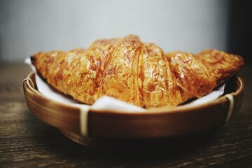Croissant on woven plate
