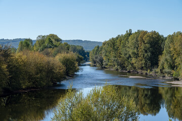 Fototapeta na wymiar view along a tree lined river