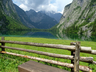 lake in the mountains, and a retro wooden fench in Germany