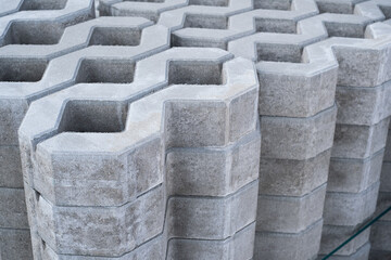 New checkered Concrete Cinder tiles of a garden sidewalk lawn in palette in store.
