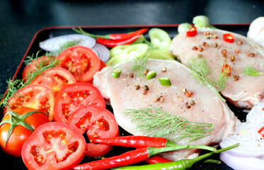 Meat with vegetables and spices, onions, red and green peppers, ginger, dill