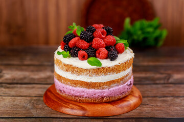 Fruit cake with fresh raspberry, blackberry and vanilla cream.