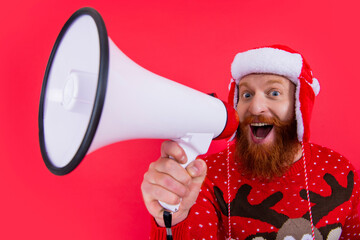 merry christmas. happy man announcing about christmas sales. man at christmas, selective focus.